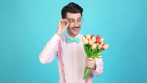 Cheerful tempting nerd guy prepare date nervous mood exciting flowers relief Video stock 161889641