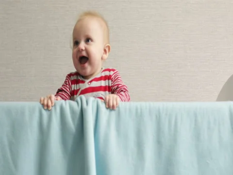 Cheerful toddler climbs into bed. Stock Footage 73791709