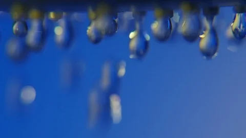 Cheerful water droplets come down from a shower nozzle in a blue bathroom Stock-Footage 87646462