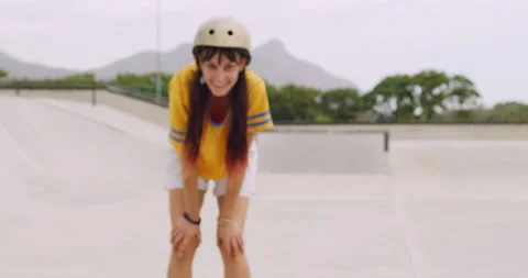 Cheerful woman skating in a roller rink outside. Portrait of trendy smiling Stock Footage