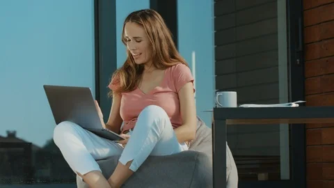 Cheerful woman talking skype on laptop outdoor. Skype business talking Stock Footage