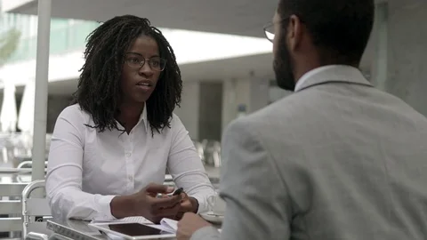 Cheerful workers shaking hands at cafe Stock Footage 114961996