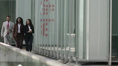 Cheerful workers talking and looking at tablet during coffee break Video stock 114963493