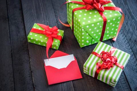 Cheerful wrapped presents and opened letter Stock Photos