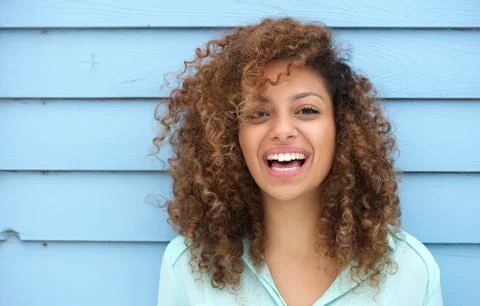 Cheerful young african woman smiling Stock Photos