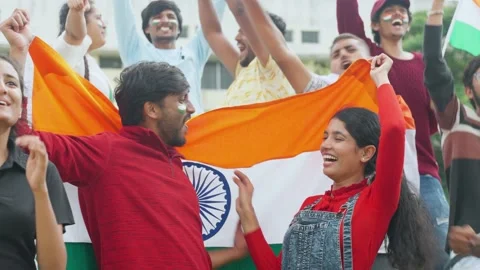 Cheerful young couples with Indian flag shouting or screaming for win or for Stock Footage 219797086