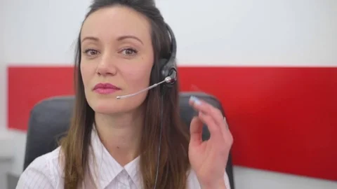 Cheerful young customer service operator, at work in call center Stock Footage 74064922