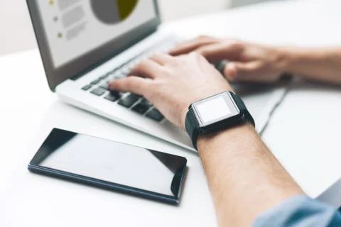 Cheerful young guy is using a notebook Foto stock