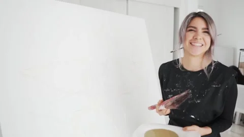 Cheerful Young Hispanic Painter Holding Paintbrush And Palette Starting To Stock Footage 152656449