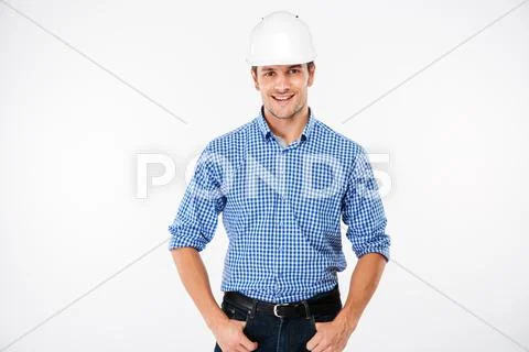 Cheerful young man building engineer in hard hat Stock Photos