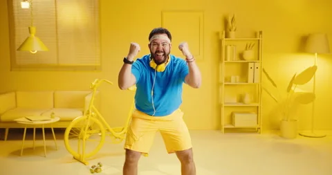 Cheerful young man expressing his success after finishing exercise and looks Vídeos de archivo 165865508