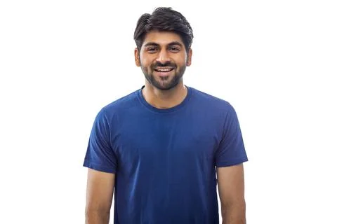 A CHEERFUL YOUNG MAN LOOKING AT CAMERA AND SMILING Stock Photos