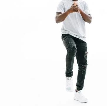 Cheerful young man in a white t-shirt . isolated on white Stock Photos