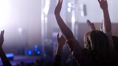 Cheerfully dancing jumping hands clap in air female fans at the concert Stock-Footage 48739913