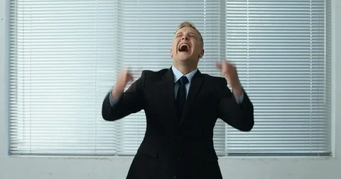 Cheering Businessman standing by the window Stock Footage 100948842
