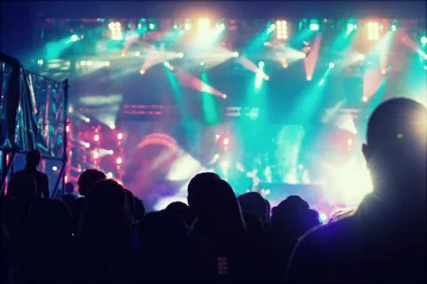 Cheering crowd in front of stage lights - retro photo 스톡 사진