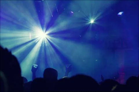 Cheering crowd in front of stage lights - retro photo Stock-Fotos
