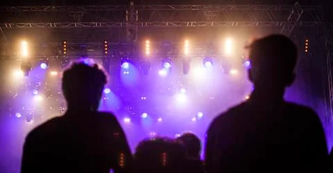 Cheering crowd in front of stage lights - retro photo 스톡 사진