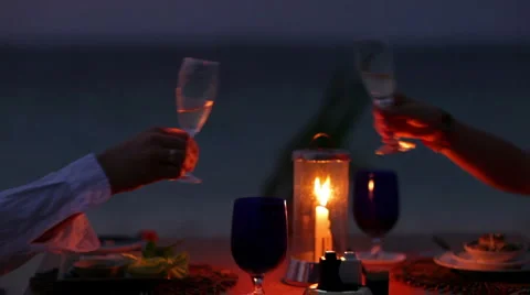 Cheering at each other at candlelight Stock Footage 1018657