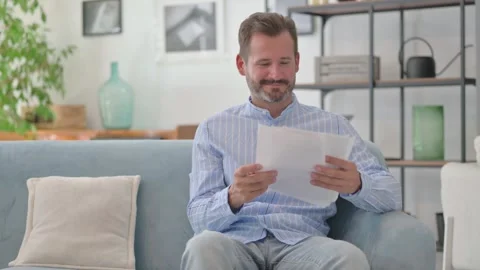 Cheering Middle Aged Man Enjoying Successful Business Report Stock Footage 287897703