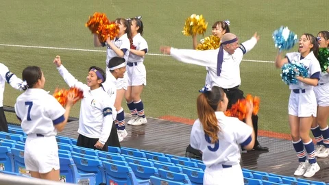 The cheering squad on the sidelines in Meiji Jingu Baseball Stadium in Tokyo Stock Footage 125772450