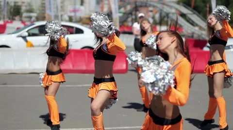 Cheerleader dancing outdoors Stock Footage 53876296