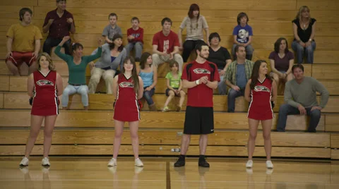 Cheerleader Skips in Front of Audience Stock Footage 35245871