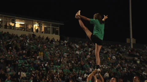 Cheerleader stunt - slow motion Stock Footage 27565258