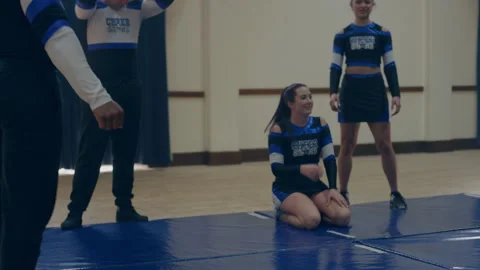 Cheerleaders doing a warm up Stock Footage 279768954