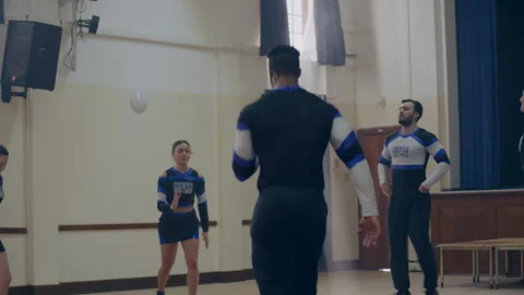 Cheerleaders doing a warm up training Stock Footage 279768657