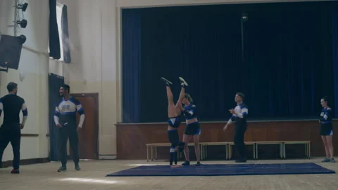 Cheerleaders doing a warm up training together Stock Footage 279767843