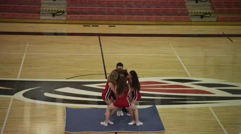 Cheerleaders Practice Throwing and Catching Girl Stock Footage 35245488