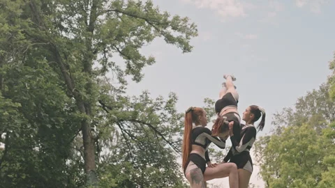 Cheerleading Squad Performing Two and Half High Pyramid Stock Footage 249267282