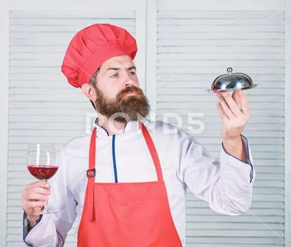 Cheers to friends. serve food. Cuisine culinary. man holds kitchen dish tray in Stock-Fotos