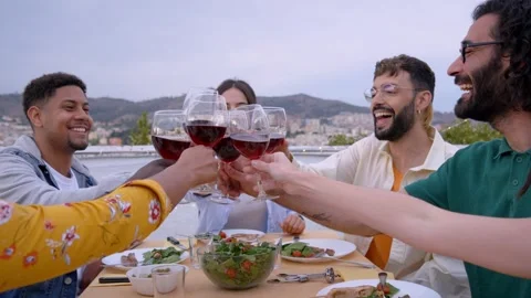 Cheers Gathering of happy young friends celebrating BBQ dinner on rooftop Stock Footage 270331663