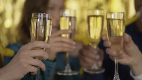 Cheers! glasses with sparkling wine close-up. 4 people of mixed race at a party Video stock 108754751