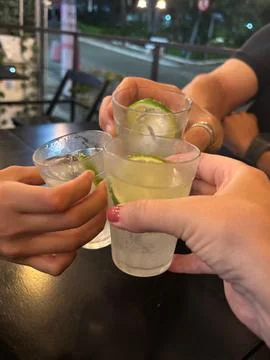 Cheers with lemon drinks Stock Photos