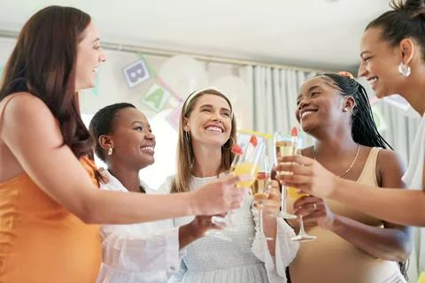 Cheers to you mama. a group of female friends toasting to their pregnant f... Stock Photos