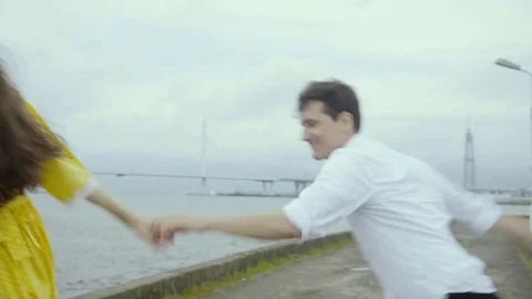 Cheery boy and girl dance emotionally some swift jazz bop on a pier on a sea Stock Footage 80200439