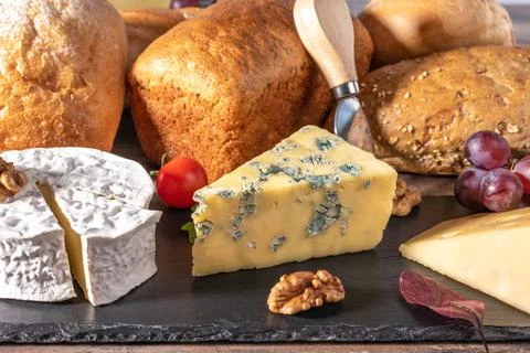Cheese and bread. many types of bread and cheese. cheese platter, tasting and Stock Photos