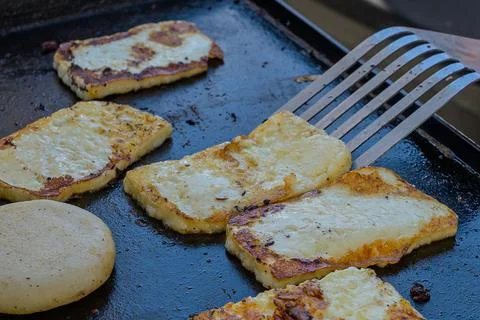 Cheese and Corn Meal on the Griddle Stock Photos