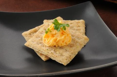 Cheese and crackers Stock Photos