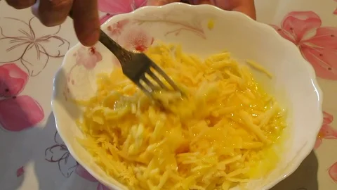 Cheese And Eggs Mixing With The Fork. Stock Footage