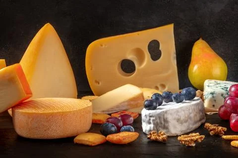 Cheese and fruit. A selection of european cheeses Stock Photos