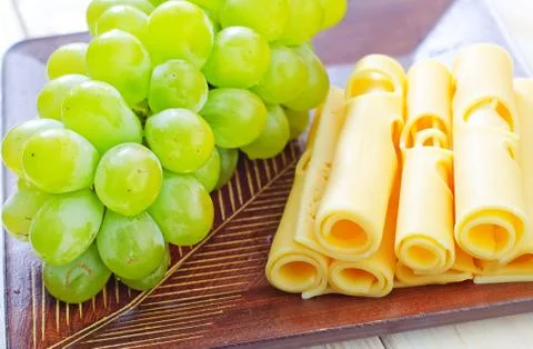 Cheese  and grape Stock Photos