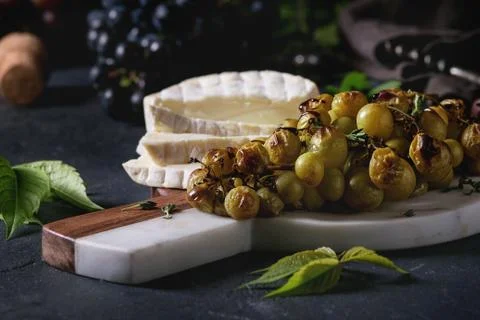 Cheese and grapes. Stock Photos