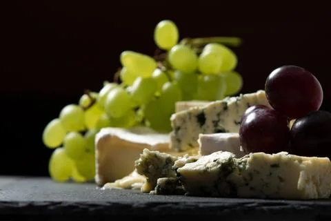 Cheese and Grapes on a Serving Platter in Studio Stock Photos