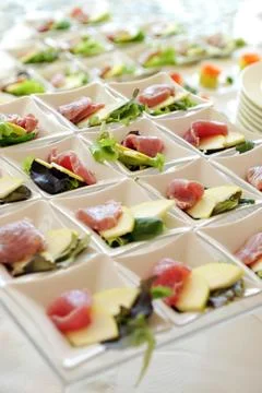Cheese and ham appetizers on a buffet Stock Photos