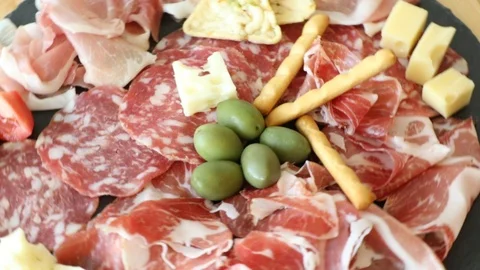 Cheese and meat appetizer selection Stock Footage 125909842