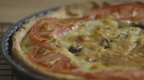 Cheese and tomato flan; close-up pan Stock Footage 64043356
